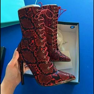 Red snake skin heeled boots